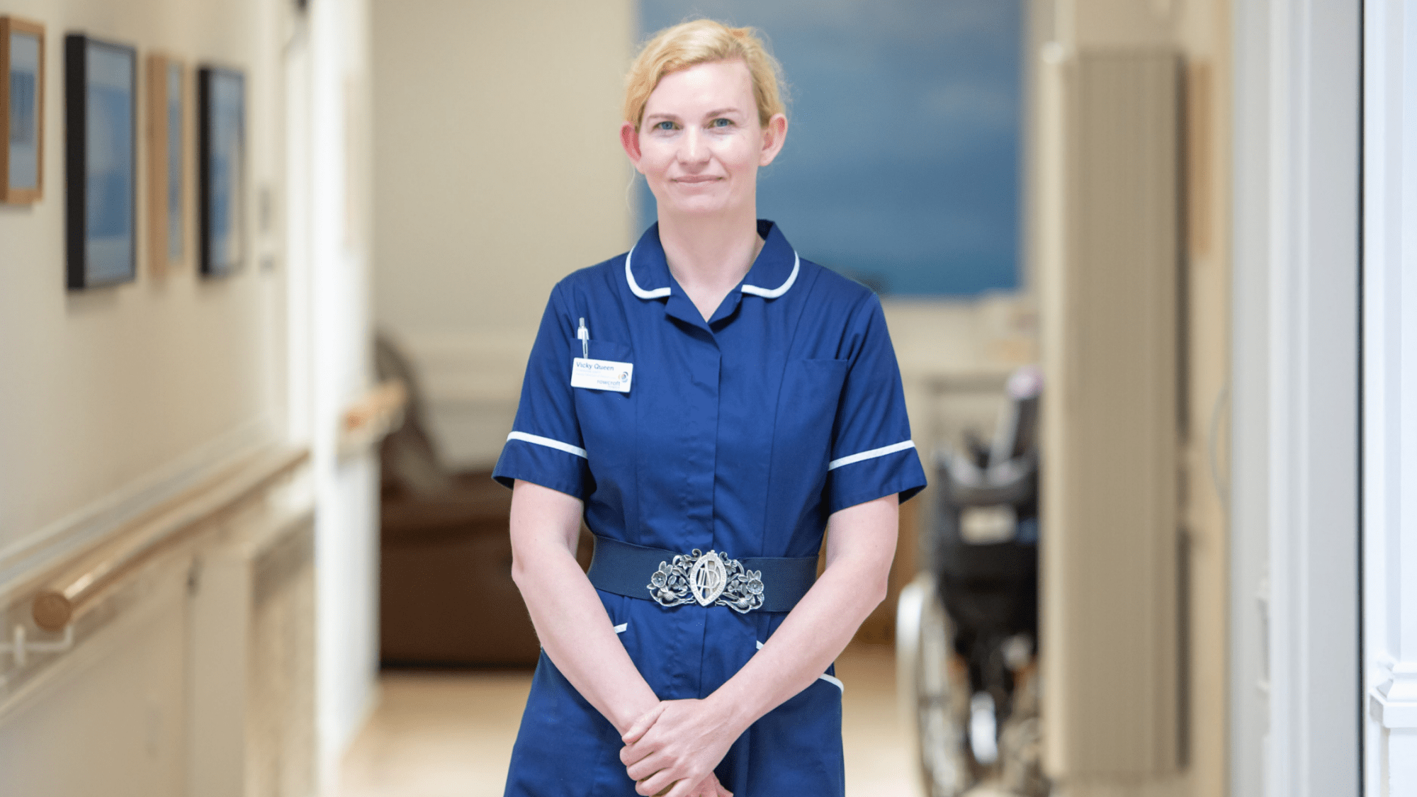 Vicky poses on the ward in nurse uniform.