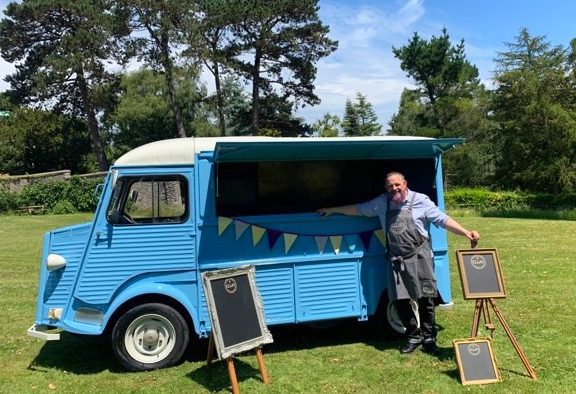 Ella's mobile Café van with its staff member Mark Choppin.