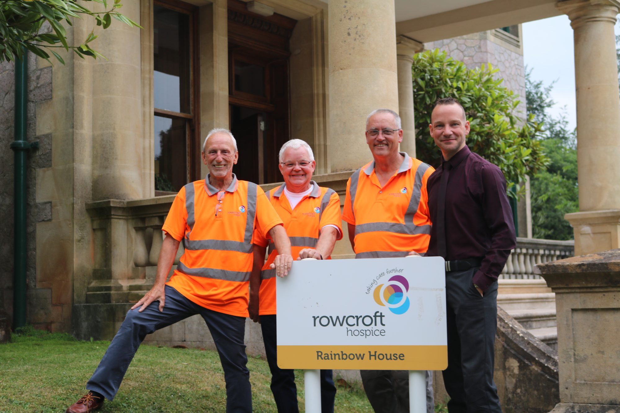 Rowcroft estates team pose outside Rainbow House for a team photo.
