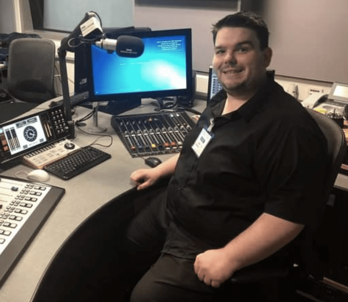 Gareth Wynn sits at a BBC Devon DJ booth