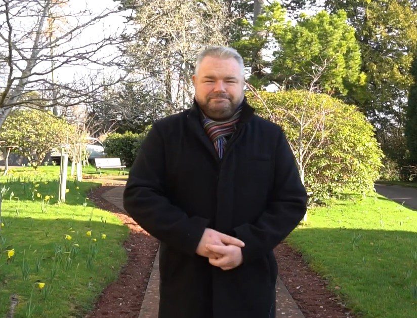 Gavyn Webber stands in the Rowcroft gardens.