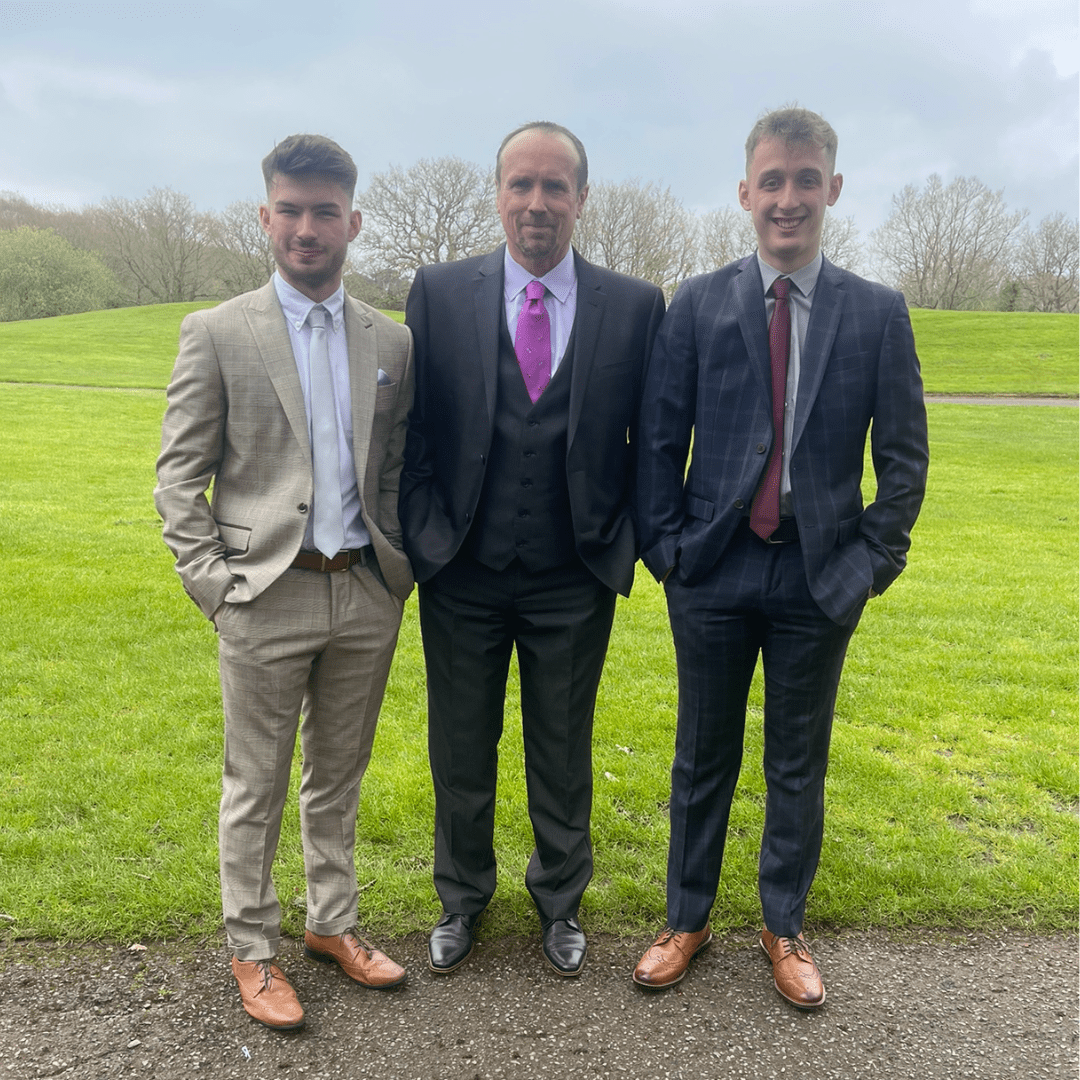 Paul Holmes (centre) with step-sons Ben (left) and Jake (right)