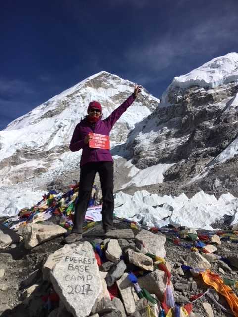 Rowcroft fundraiser Jane poses at Mount Everest for a photo.