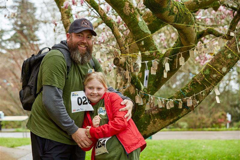 Jon and Eva Scott stood in front of the memory tree.