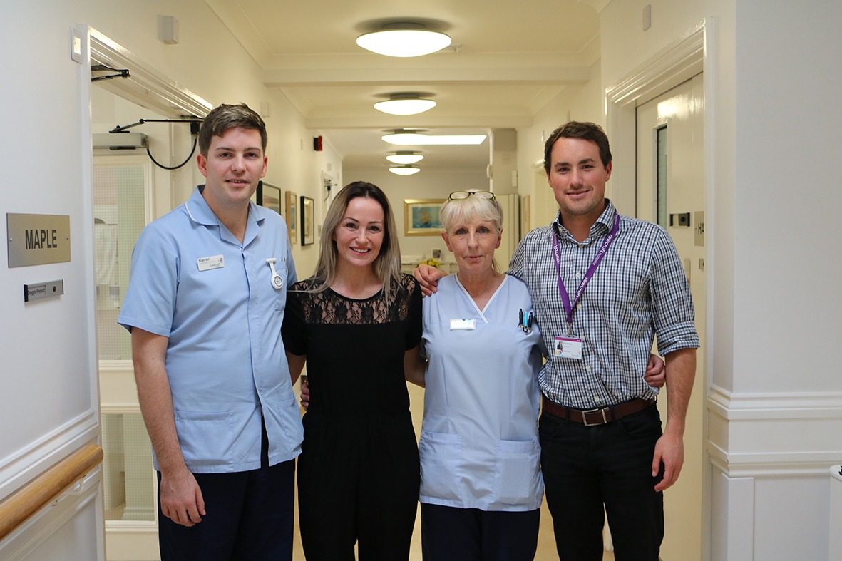 Keedie Green poses with staff at Rowcroft Hospice for a photo.