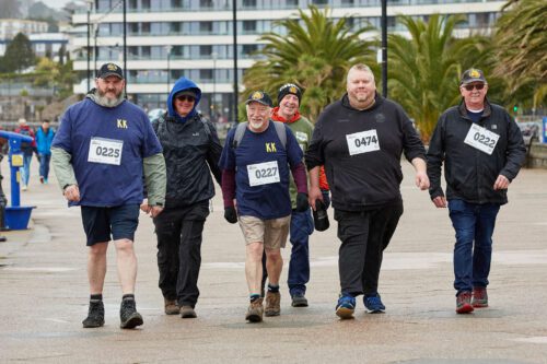 A group of men walking their eight-mile sponsored walk