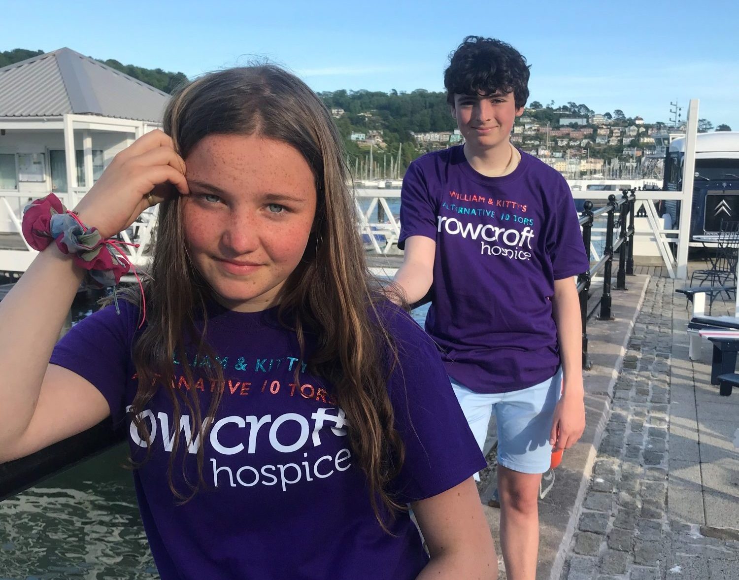 Two Rowcroft fundraises pose in their purple Rowcroft t-shirts.