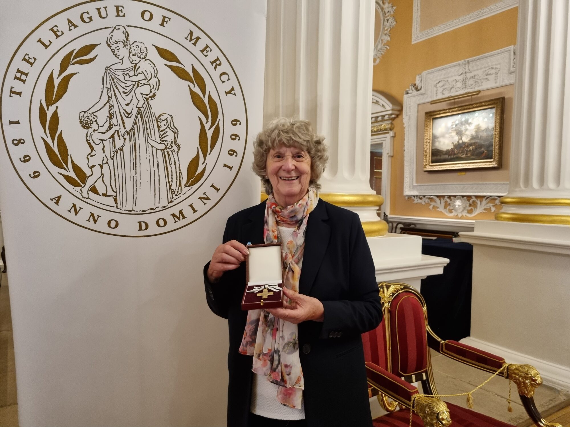 Pat Goss and her 'Order of Mercy' Award.