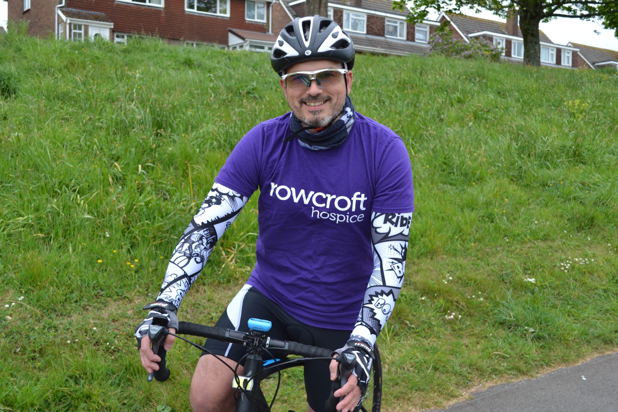 Chris is seen smiling at the camera ahead of his 100km bike ride in aid of Rowcroft.