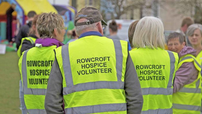 Rowcorft Hospice volunteers from behind in a group.