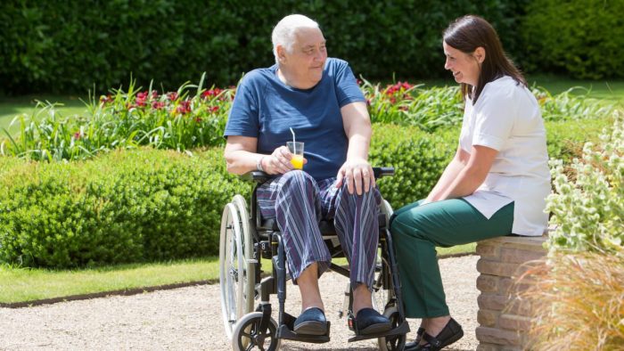 Rowcroft Hospice Occupational Therapist and Patient in Grounds chatting
