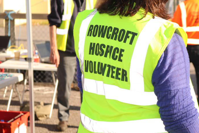 The back of a Rowcroft Hospice volunteer's high visibility jacket.