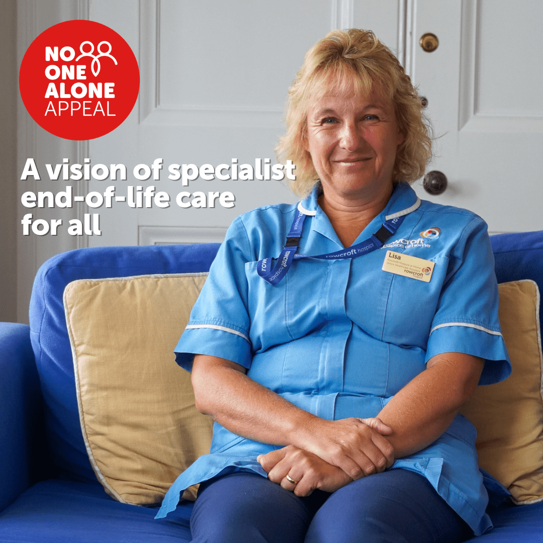 A senior Rowcroft Healthcare Assistant sits on a blue settee.