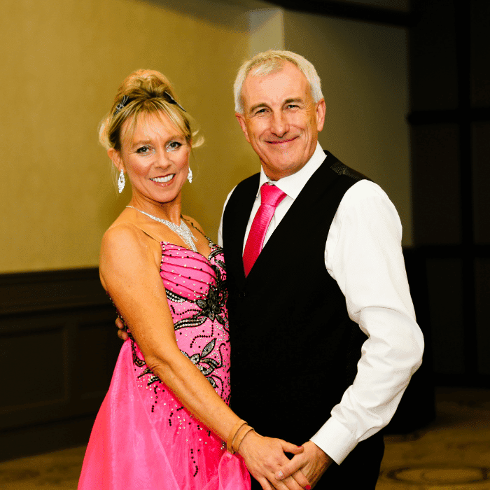 A couple hold one another as they wait to dance