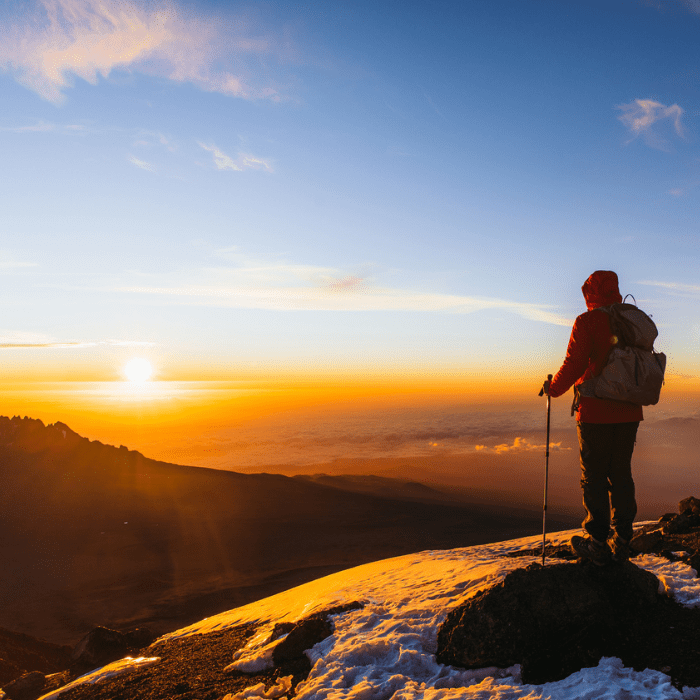 A lone climber on top of Mount Kilimanjaro.