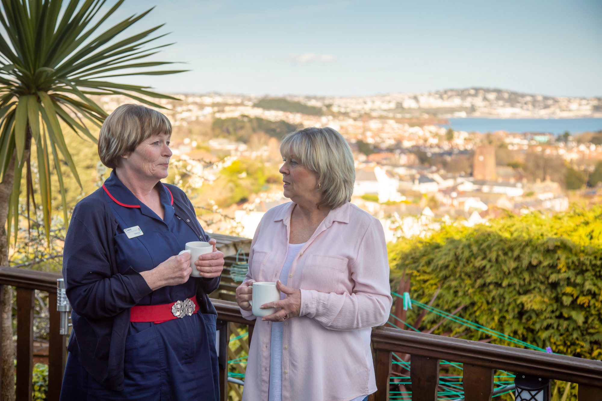 Claire comforts a patients family member overlooking Torbay.