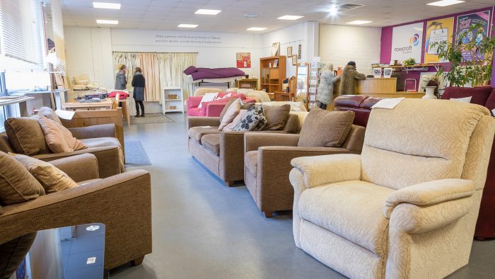Some cream sofas and brown chairs at the Torquay Furniture Outlet.
