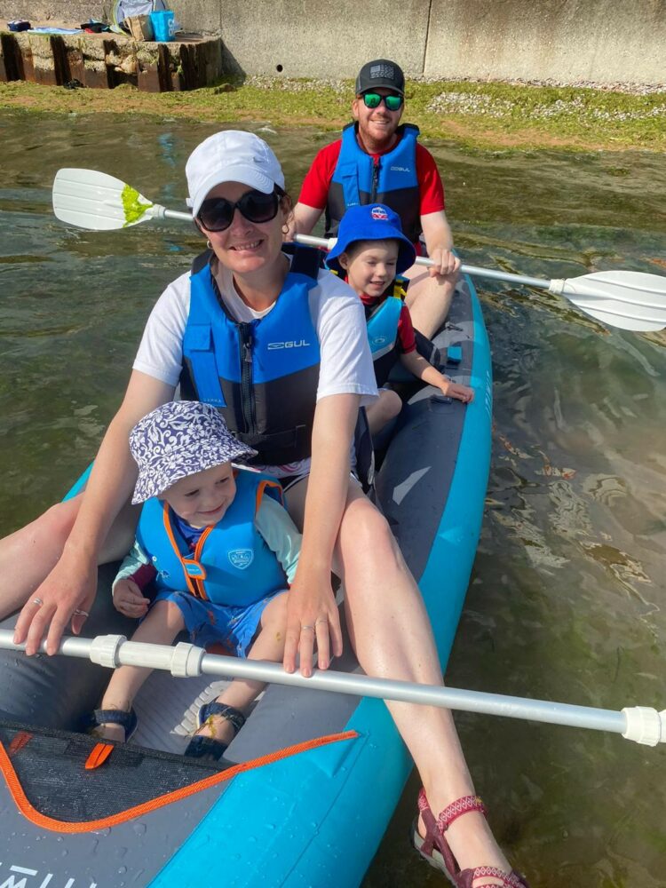 Tracy on family kayaking day with her husband Craig and her sons Ethan (front) and Owen.