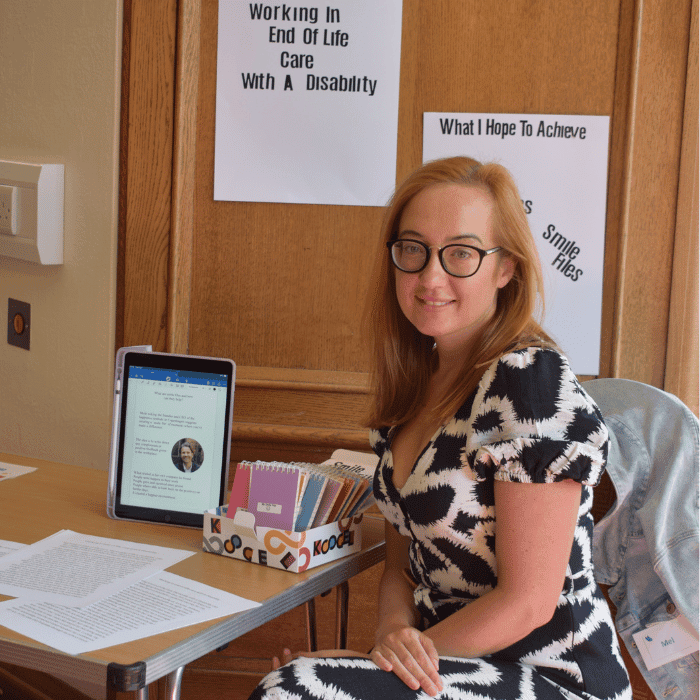 A woman sitting at a desk.