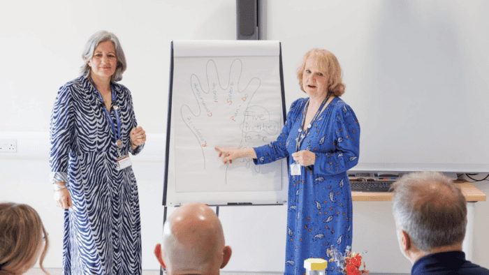 Two education trainers delivering a session.