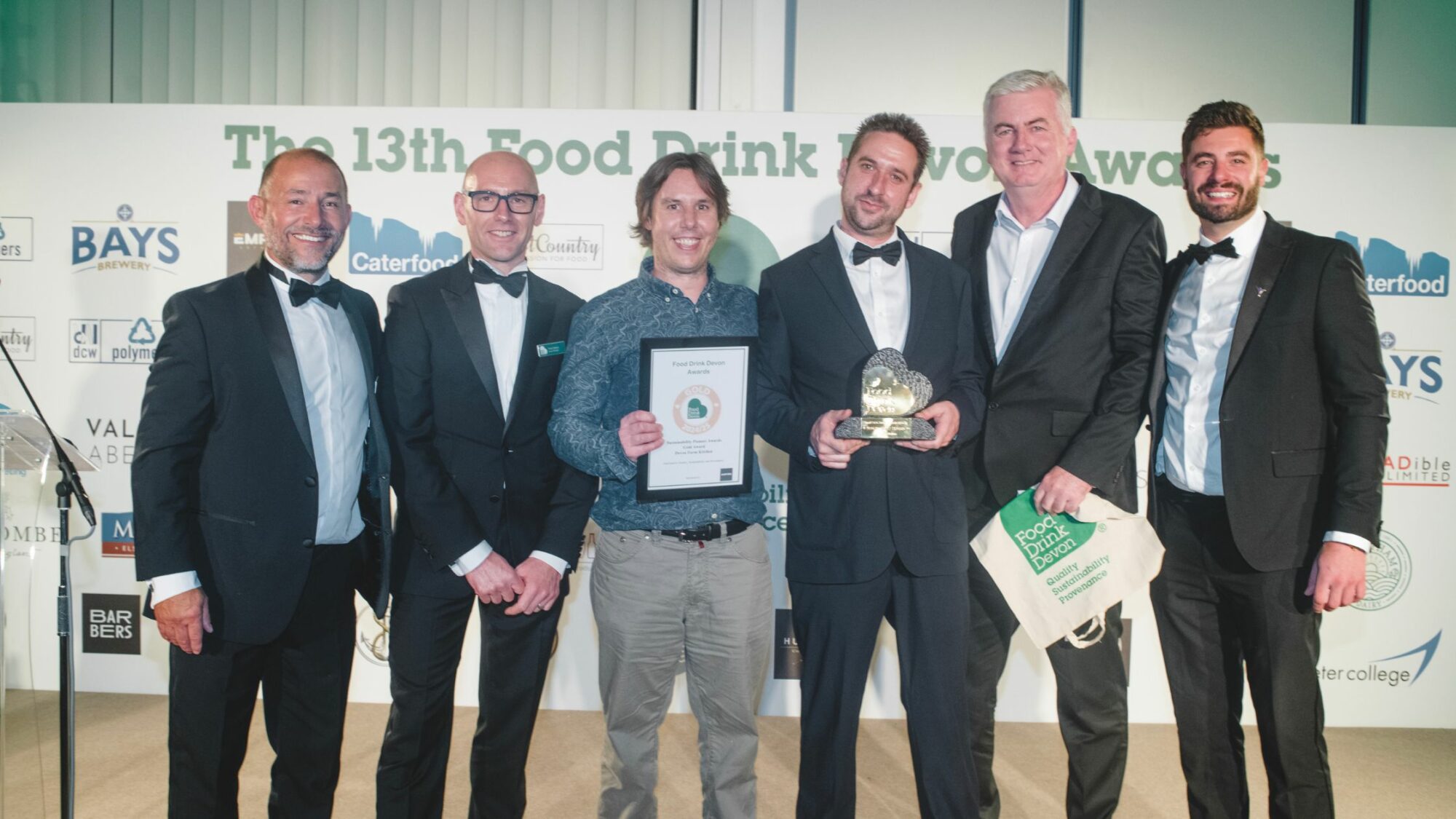 The Devon Farm Kitchen team collecting their reward at the Devon Food Drink Awards.