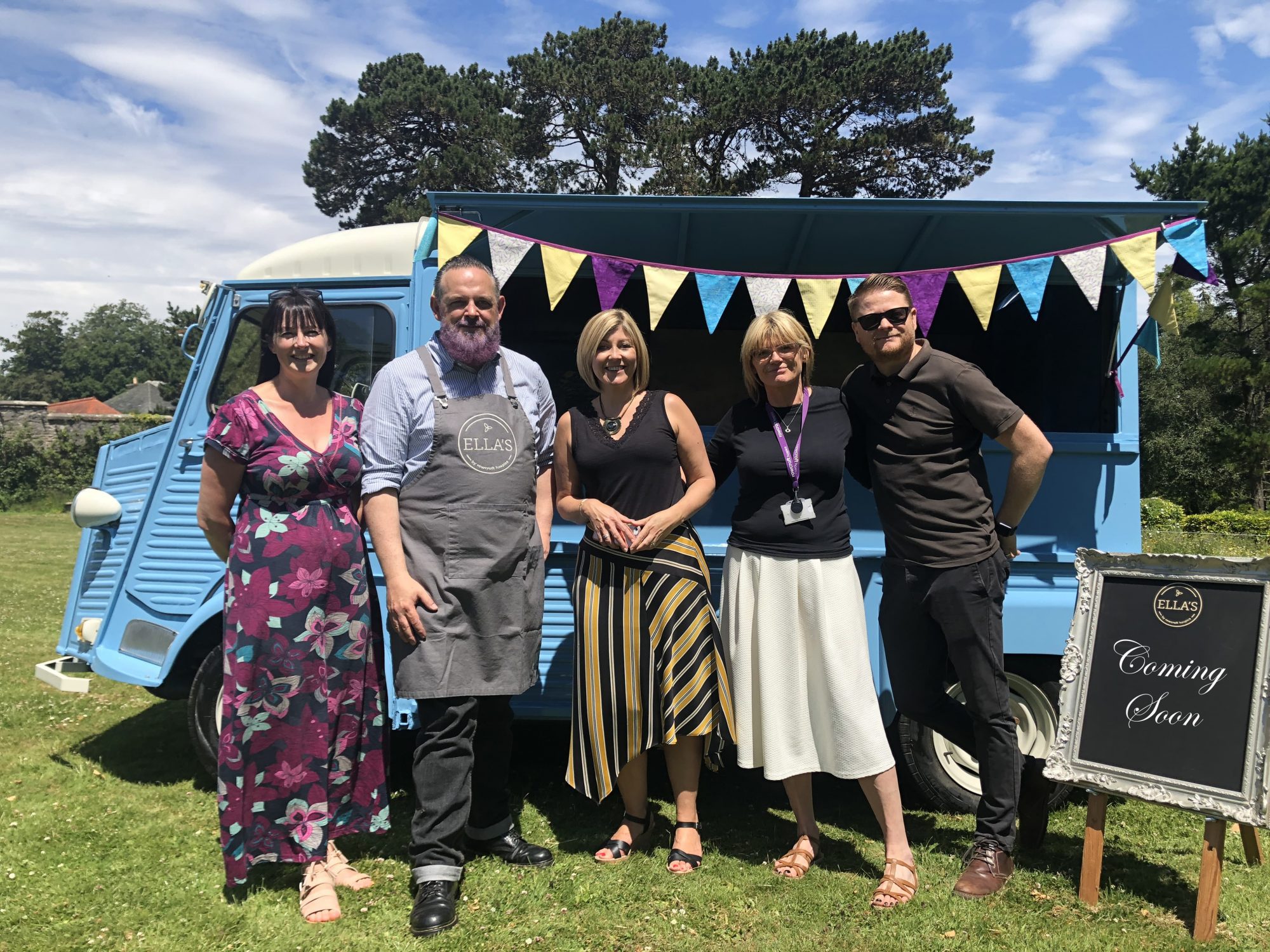 Rowcroft retail staff and Mark Choppin stand in front of the new Ella's Mobile Café van.