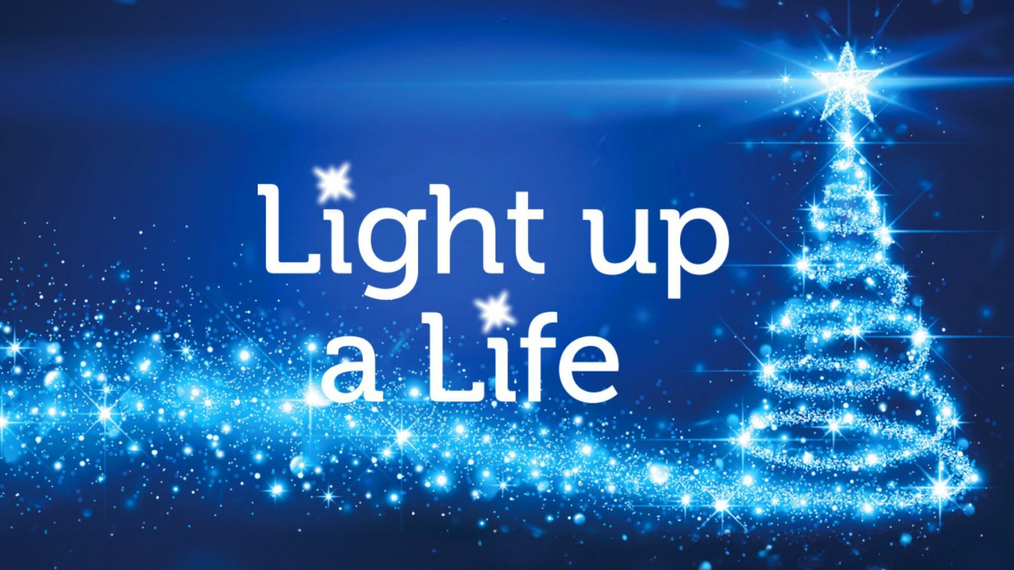 Sparkling Christmas tree with Light up a Life logo.