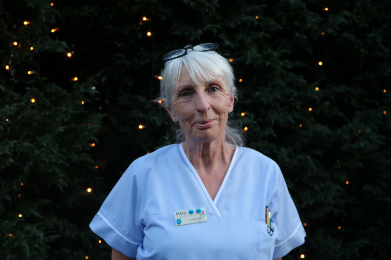 Rowcroft clinical staff member, Mary poses outside for a photo.