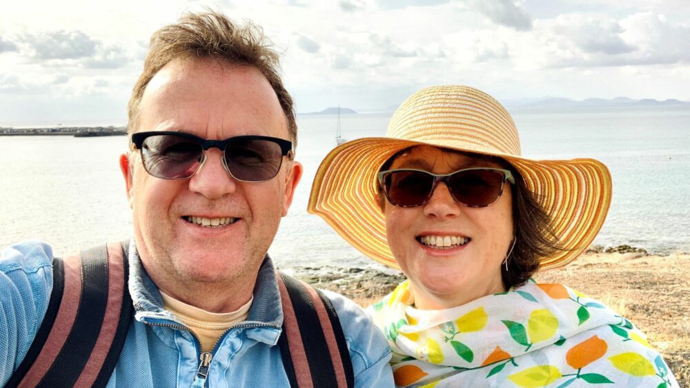 Sue Bradshaw on the beach with husband, Peter.